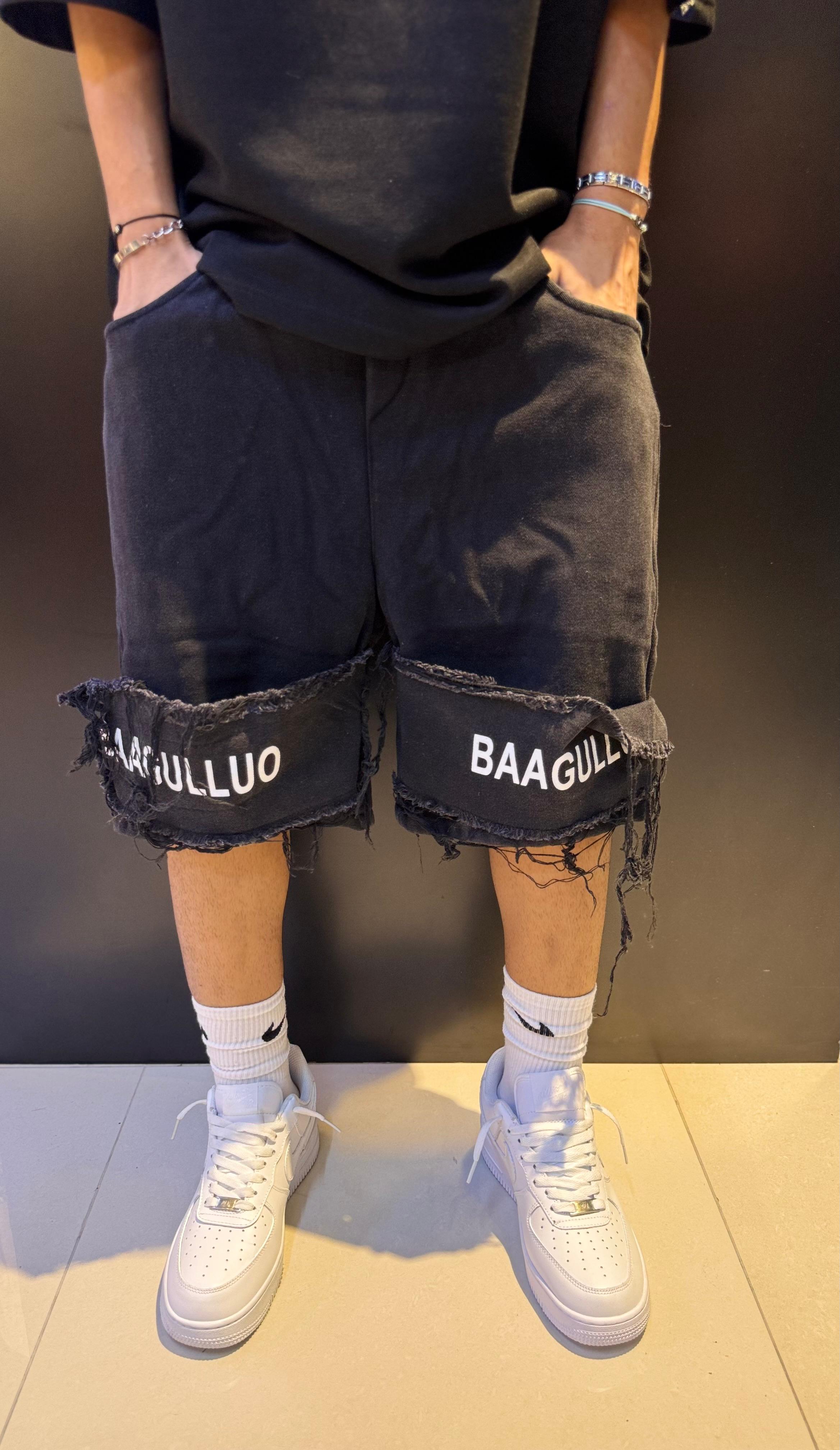 Black Distressed Shorts with White Text and Frayed Hems