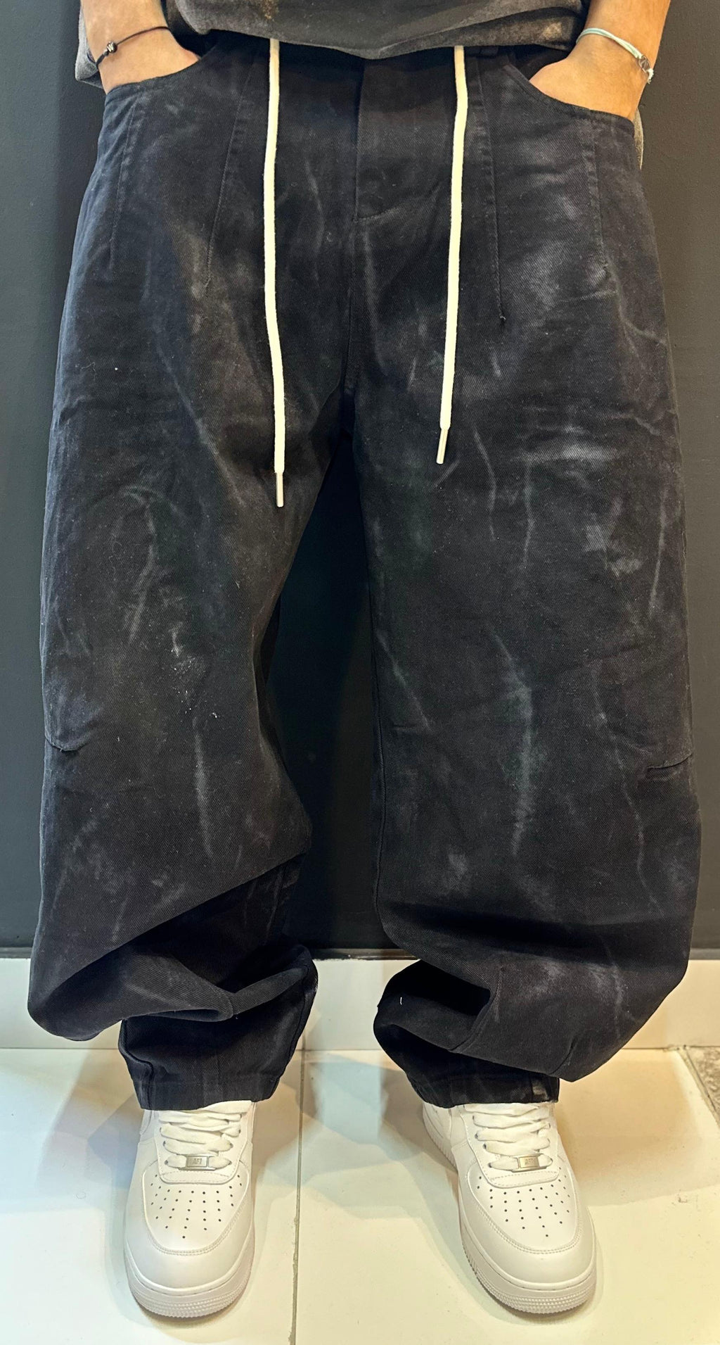 Black Baggy Trousers and Crisp White Sneakers