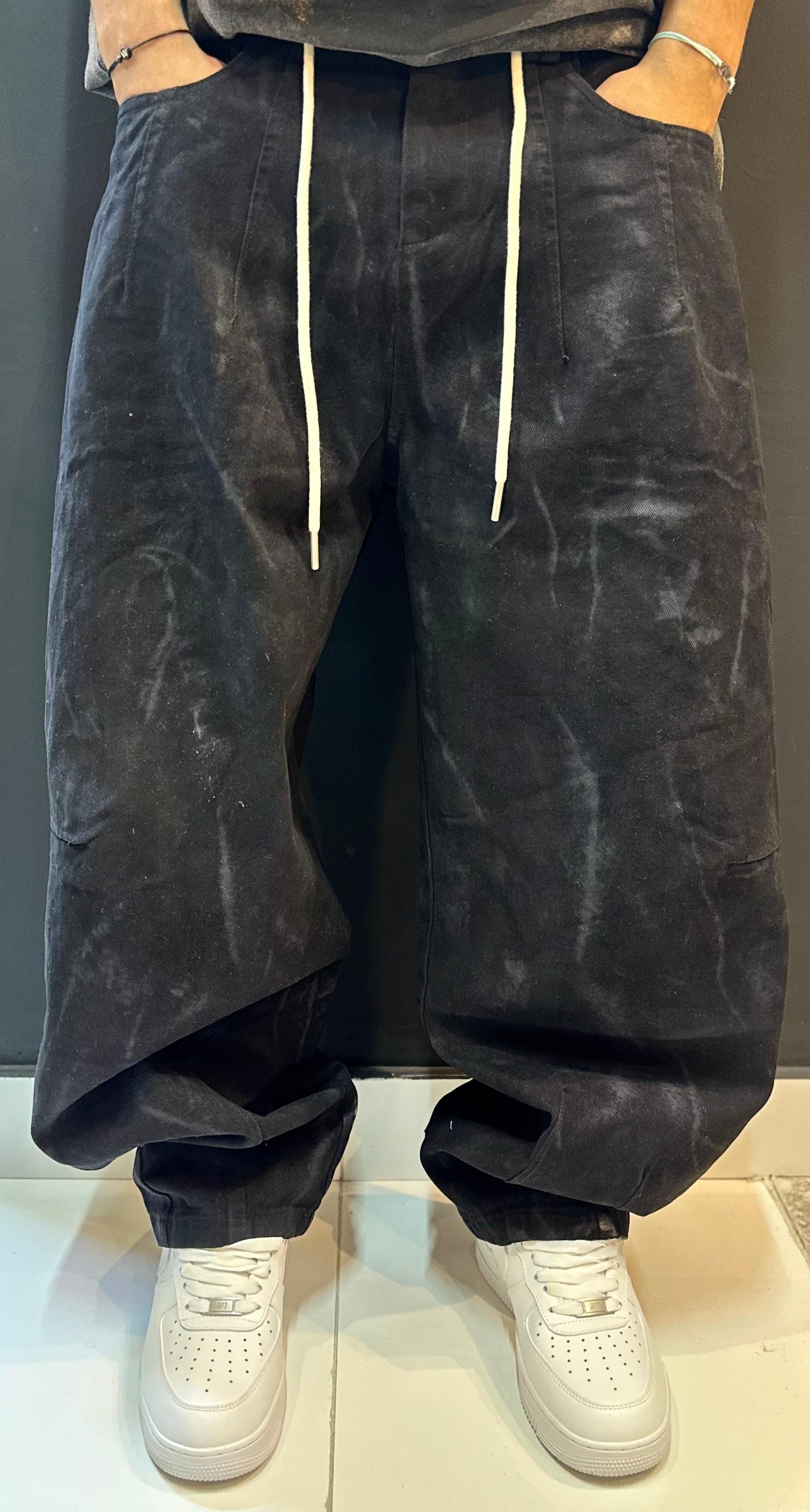 Black Baggy Trousers and Crisp White Sneakers