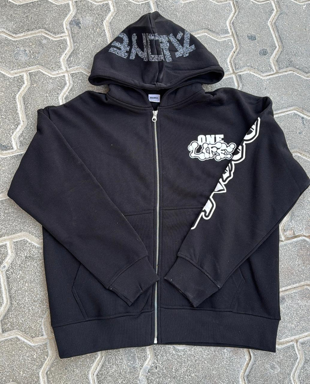 Black Oversized Full-Zip Hoodie | "ALONE" Distressed Hood Graphic | Streetwear Cartoon Print Sleeve