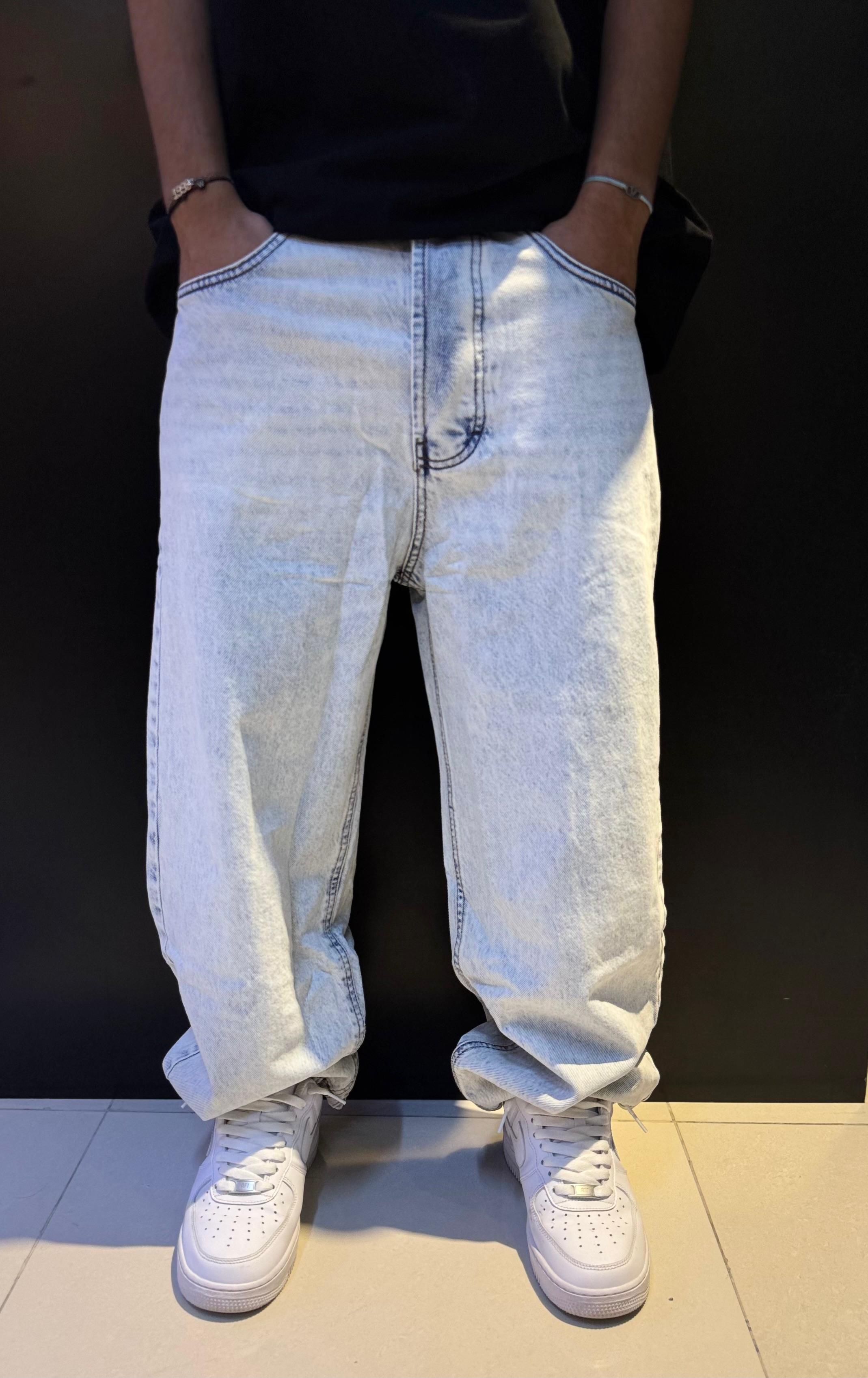 Light Blue Acid-Washed Jeans with White Sneakers